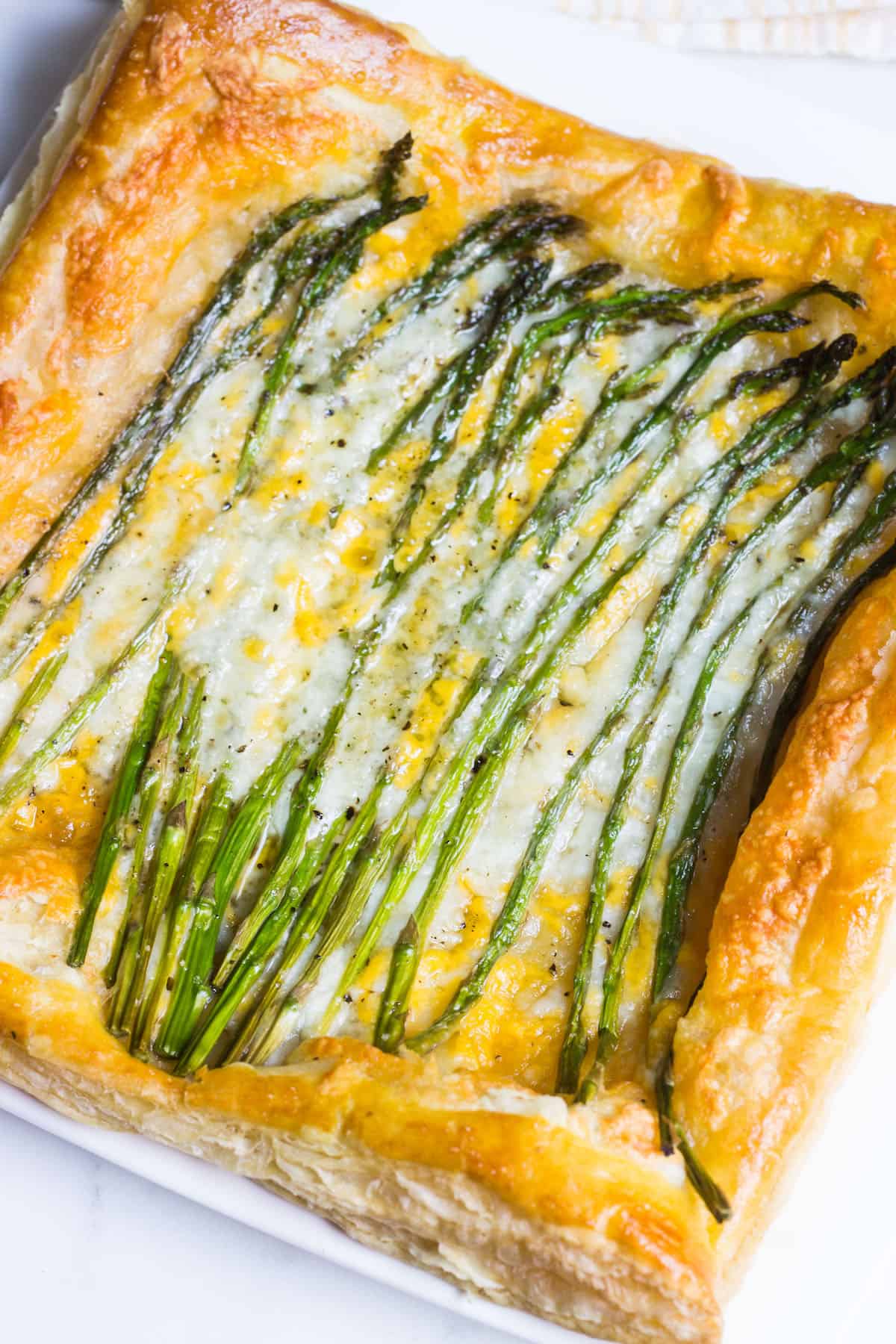 Asparagus Tart: a quick and simple appetizer or lunch using puff pastry, fresh asparagus, and cheese. Recipe via MonPetitFour.com