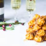 croquembouche tower of cream puffs with spun sugar - featured image