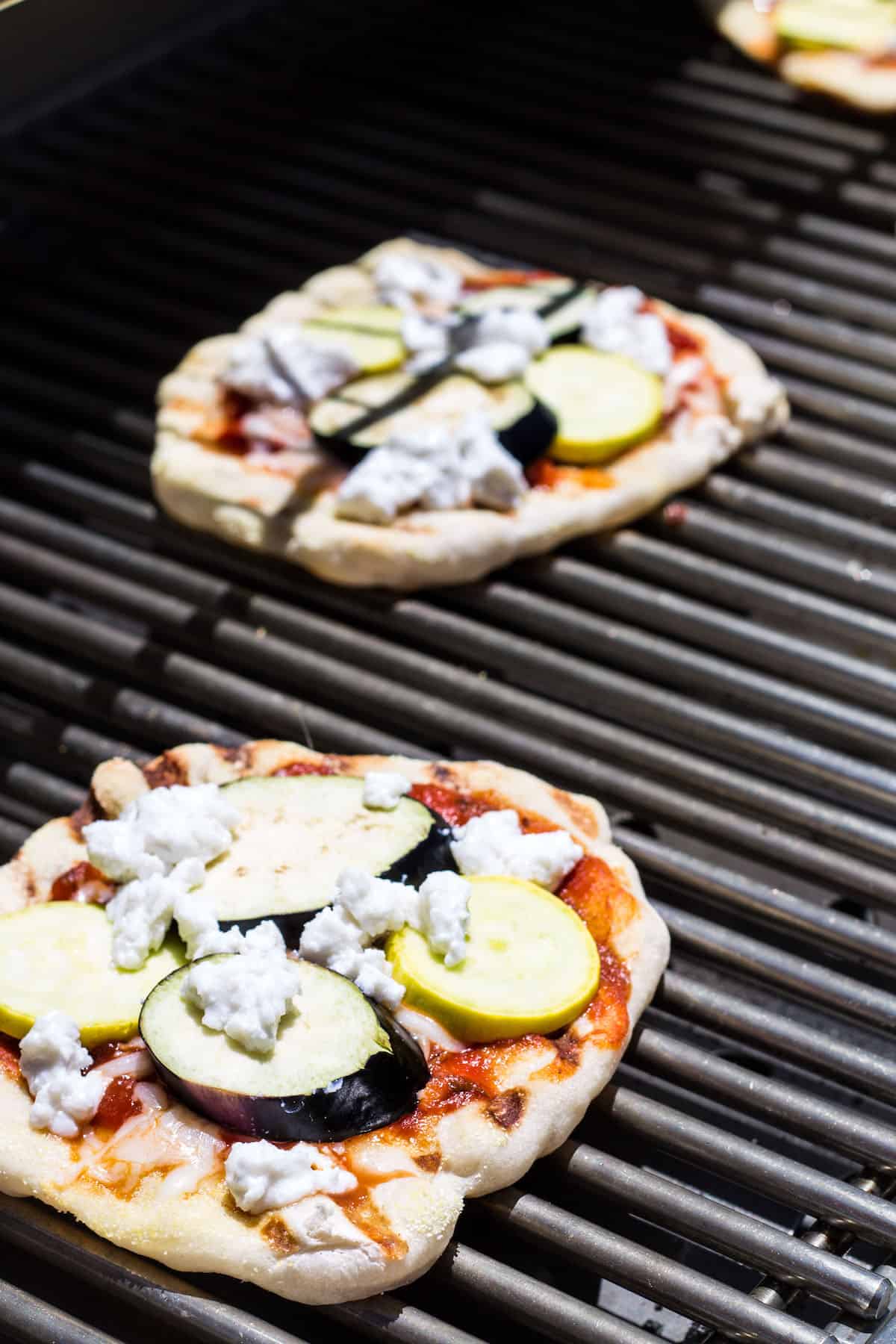 Grilled Pizza: personal size pizza made on the grill and topped with summer veggies! Recipe via MonPetitFour.com