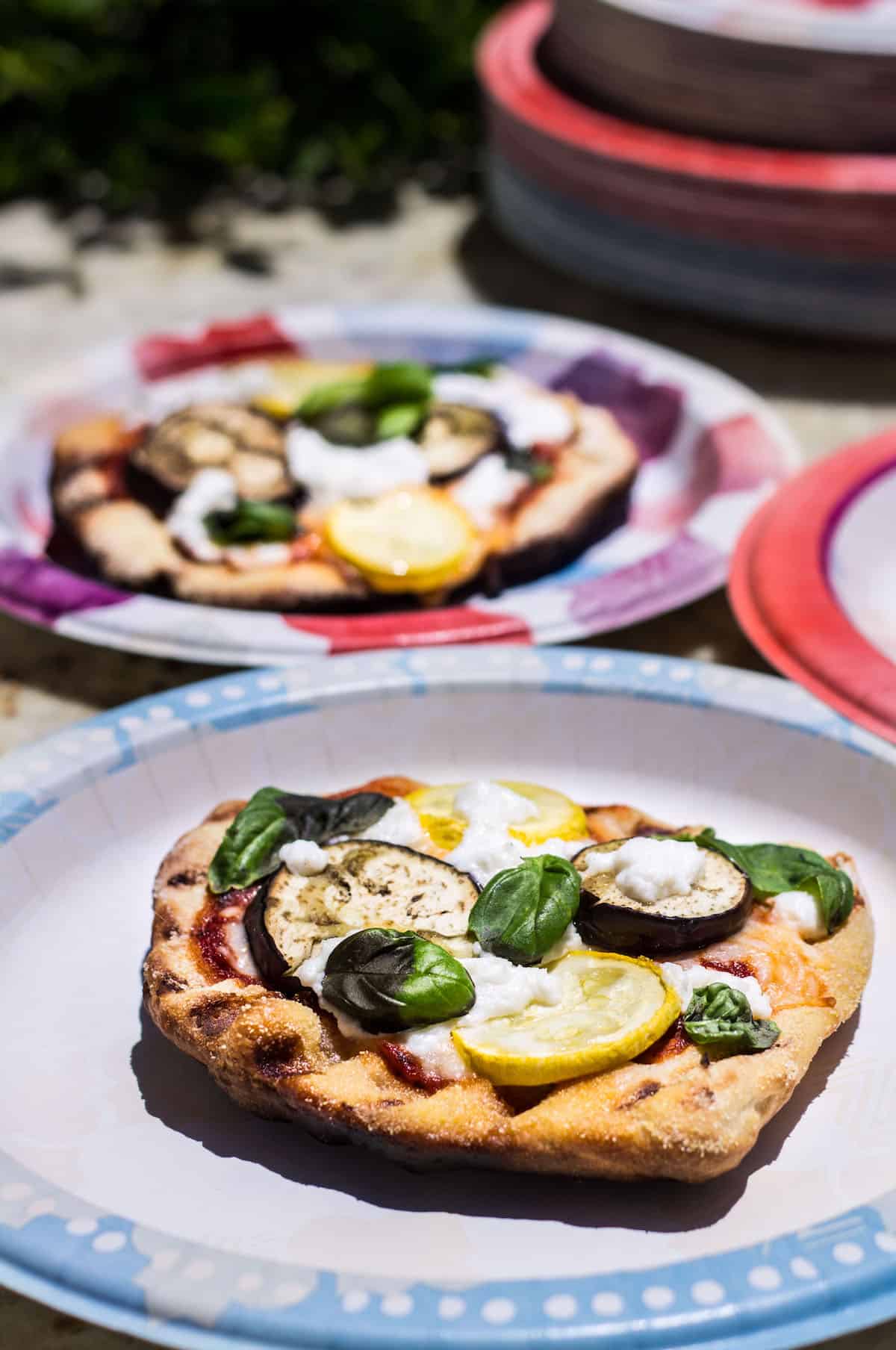 Grilled Pizza: personal size pizza made on the grill and topped with summer veggies! Recipe via MonPetitFour.com
