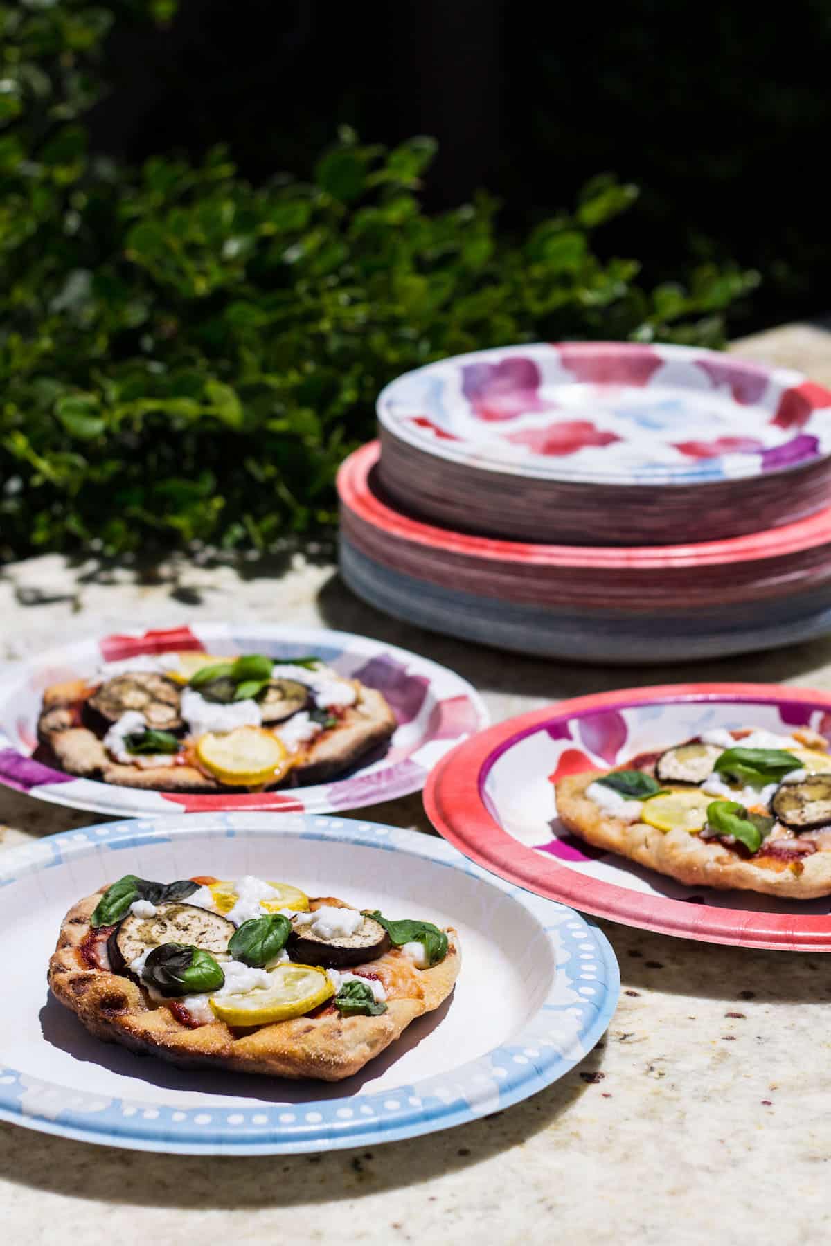 Grilled Pizza: personal size pizza made on the grill and topped with summer veggies! Recipe via MonPetitFour.com