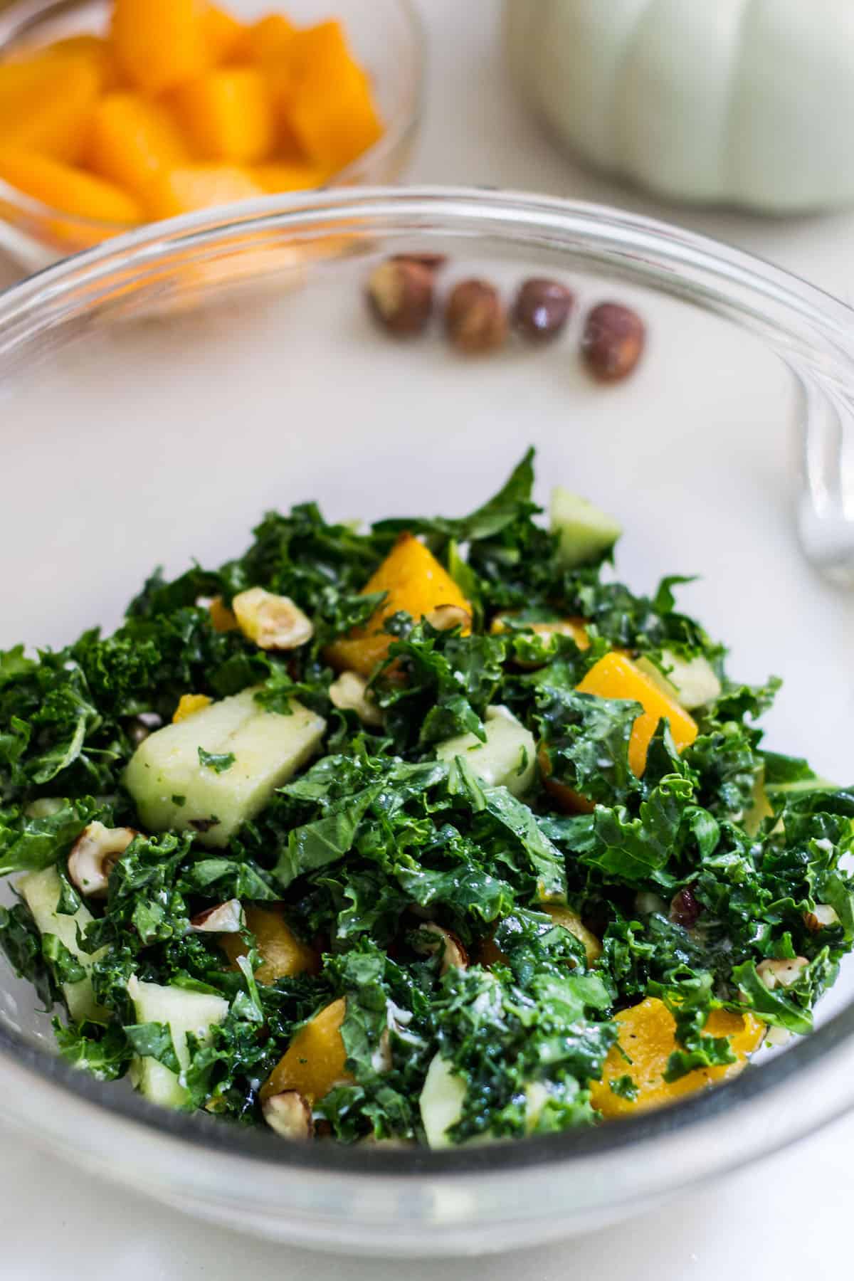 Kale Butternut Squash Salad: an easy fall salad with a tasty maple vinaigrette. Perfect for the holidays too! Recipe via MonPetitFour.com
