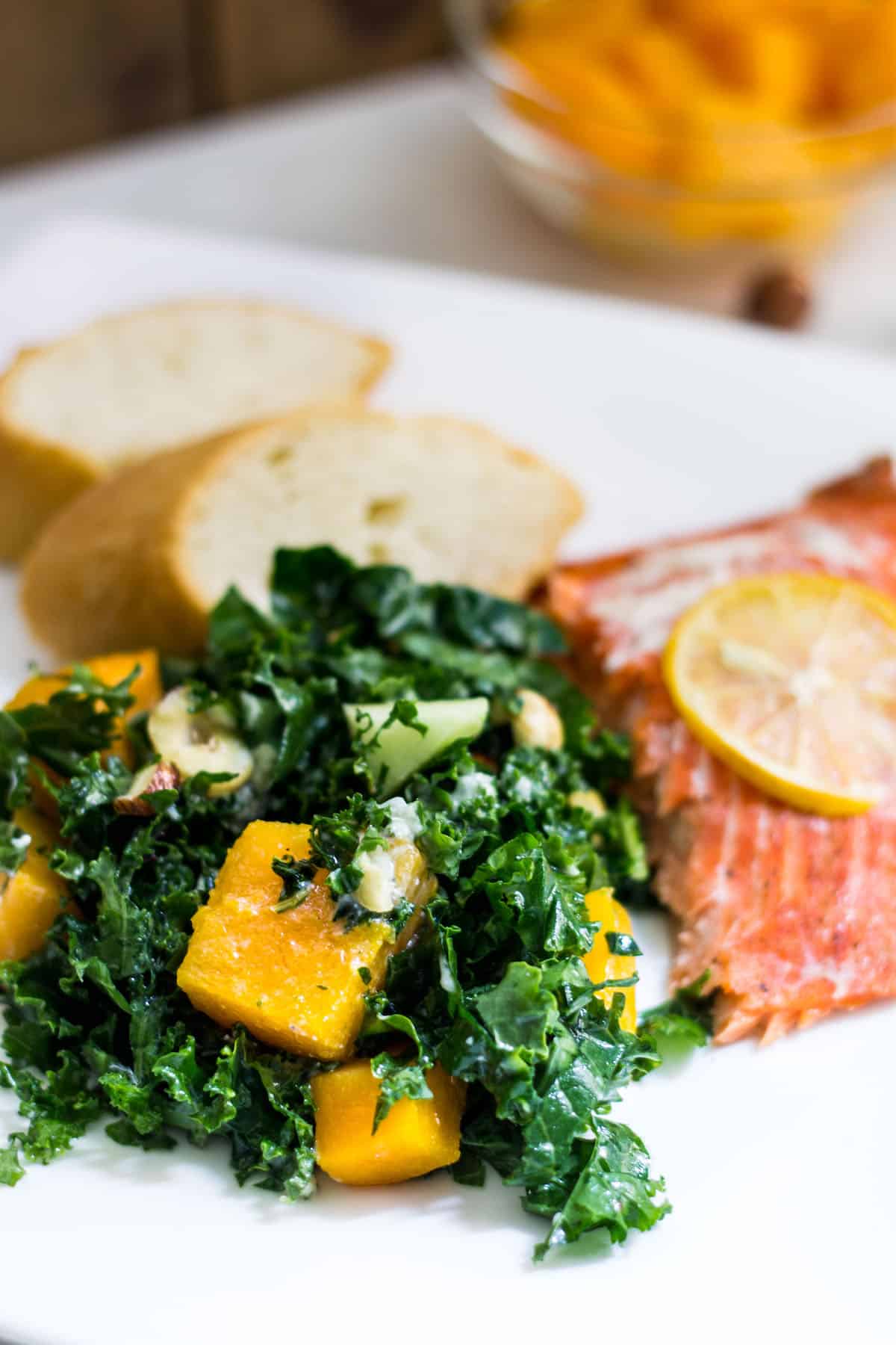 Kale Butternut Squash Salad: an easy fall salad with a tasty maple vinaigrette. Perfect for the holidays too! Recipe via MonPetitFour.com