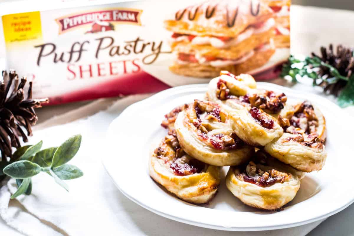 Savory Palmiers made with brie, walnuts, cranberry jelly, and Pepperidge Farm® Puff Pastry Sheets. A crowd-pleasing appetizer for any occasion or holiday! French recipe via MonPetitFour.com #ad #InspiredbyPuff