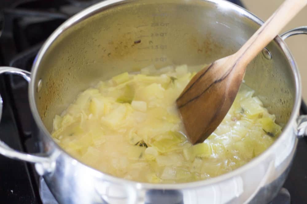 potatoes and leeks cooked in saucepan