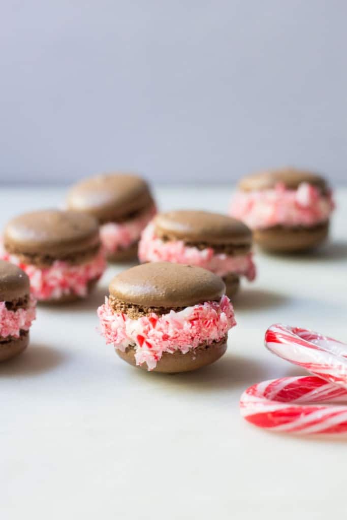 chocolate macarons with vanilla filling and peppermint candy