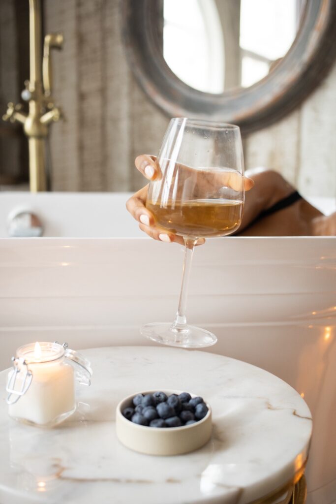 self-care routine bubble bath and wine