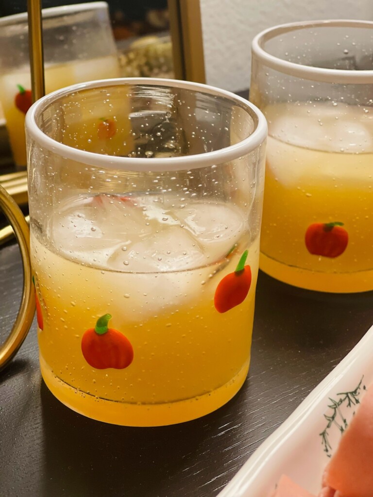 spiced cider cocktail in a pumpkin glass