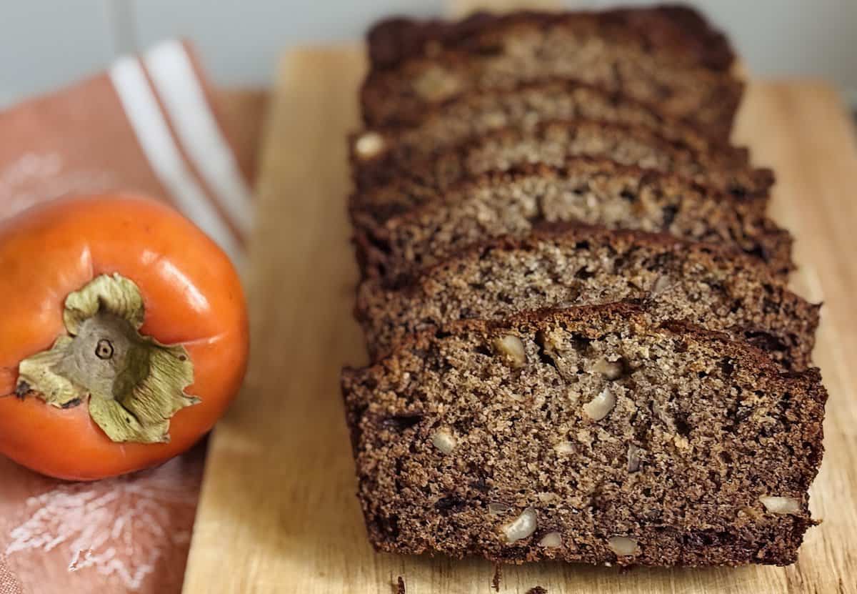 persimmon bread recipe loaf next to hachiya persimmon