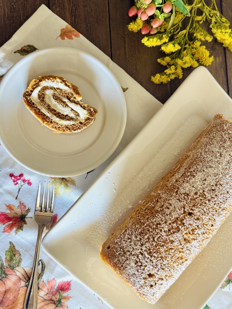 pumpkin roulade recipe slice next to cake roll overhead shot