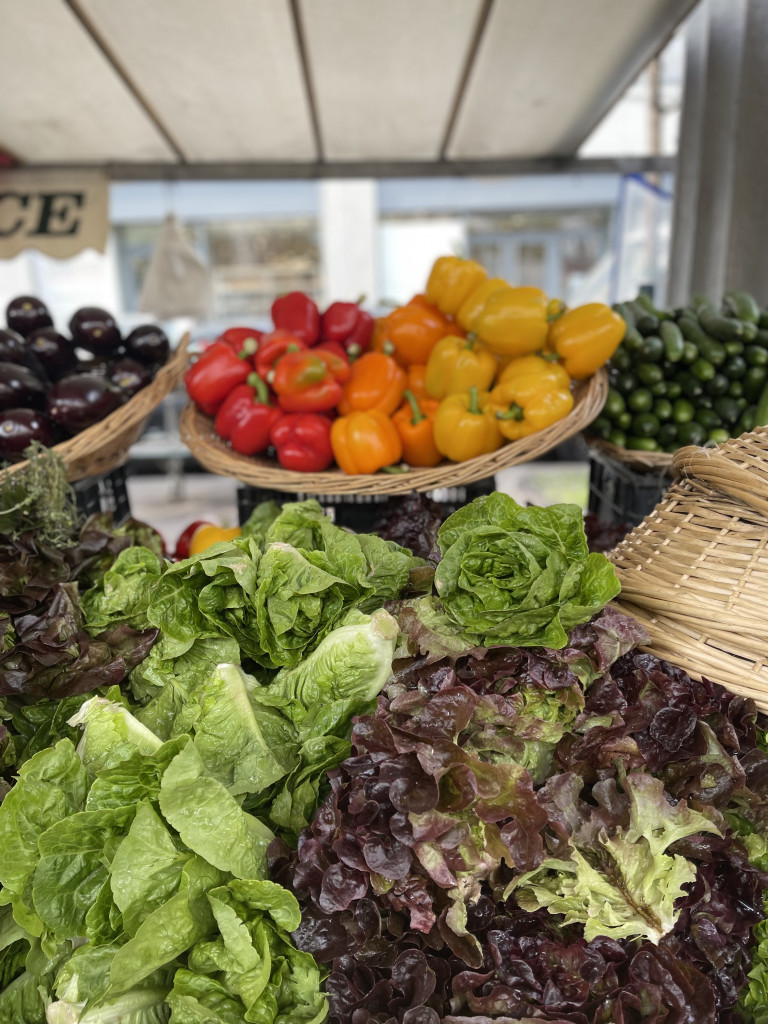 produce stand at farmers market in paris