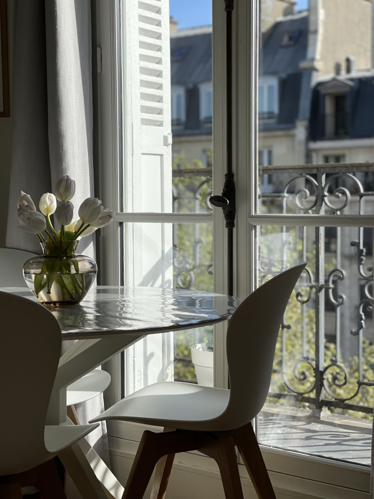 tulips on the dining table in a parisian apartment